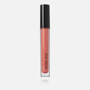 Closed tube of Mary Kay Unlimited Lip Gloss in shade Fancy Nancy standing against a grey background